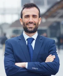 man suit looks camera smiles 260nw 606177233 e1750053931311